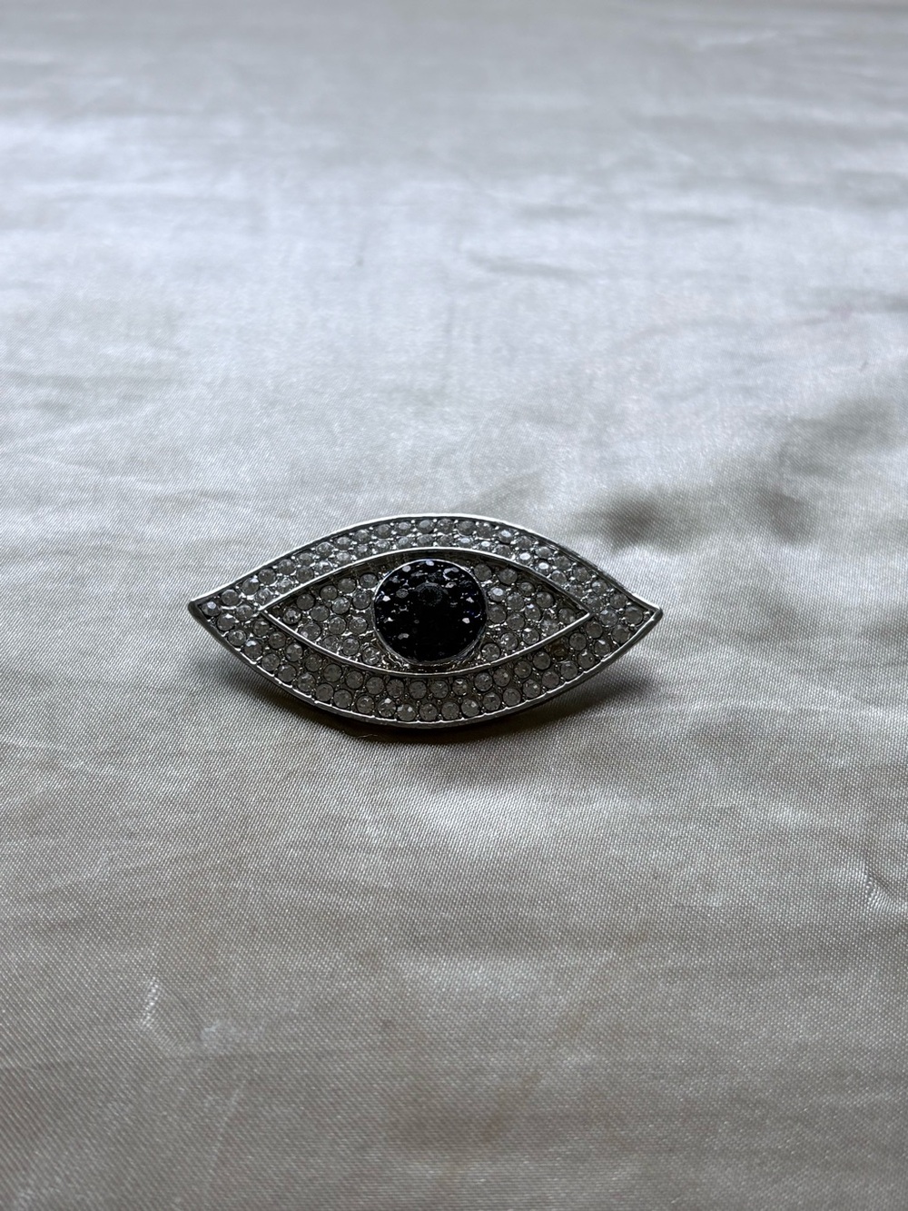 Silver and Black Eye-Shaped Crystal Brooch